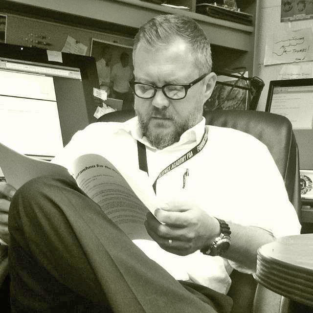 Dr. Joe Hefner reading an article